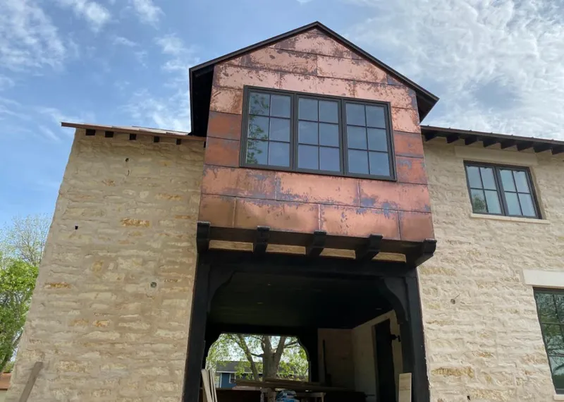 Copper metal panel facade on a stone building for Skylight Installation in Soddy-Daisy