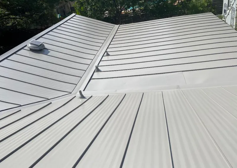 Solar attic fan installed on a metal roof for Roof Ventilation in Soddy-Daisy